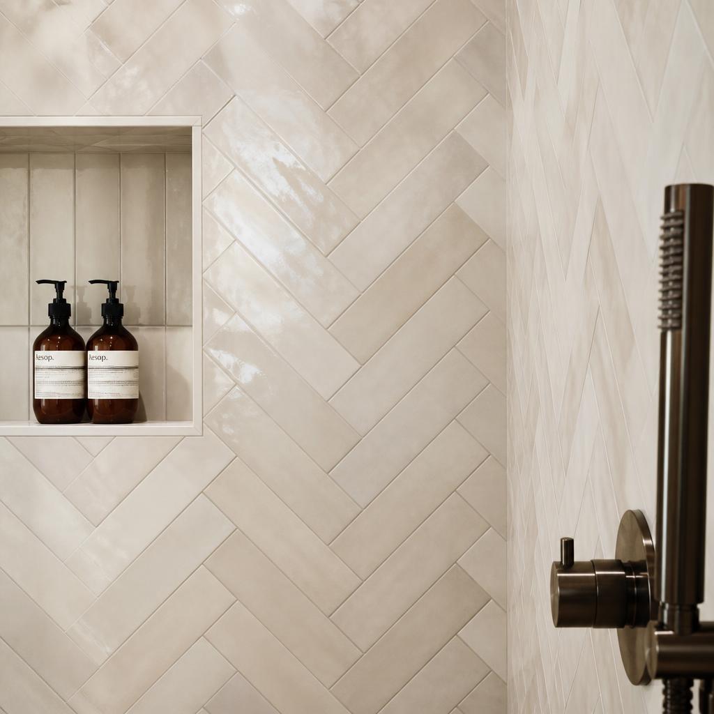 Herringbone tile wall detail in soft light